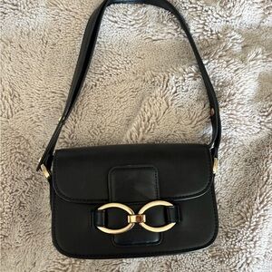 Chic Black Leather Shoulder Bag with Gold Accent